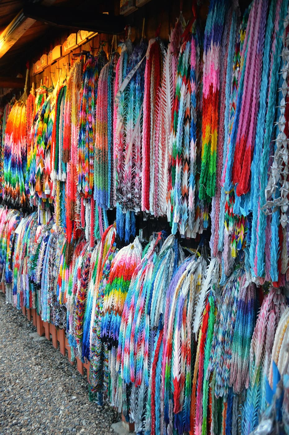 Thousands of paper cranes on strings hanging at a shrine in Kyoto